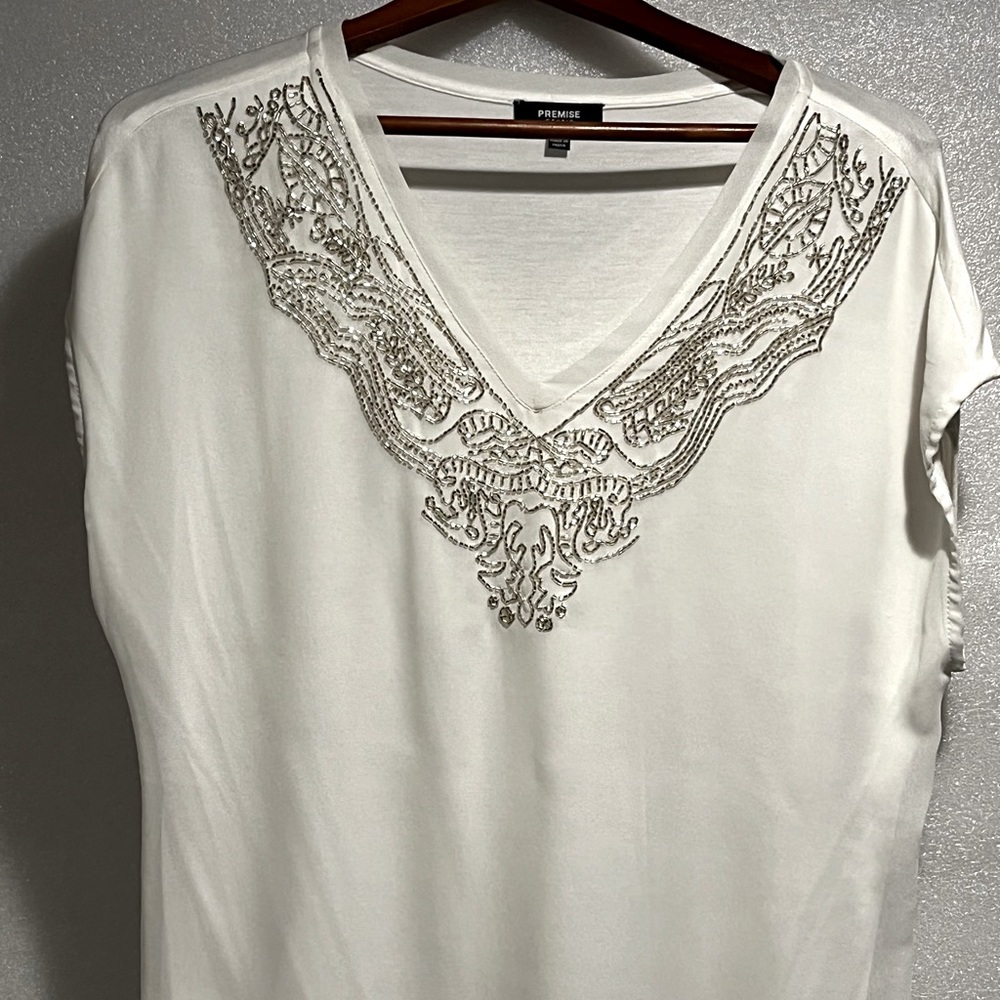 Premise Studio Silver accessorized cap sleeve shirt.